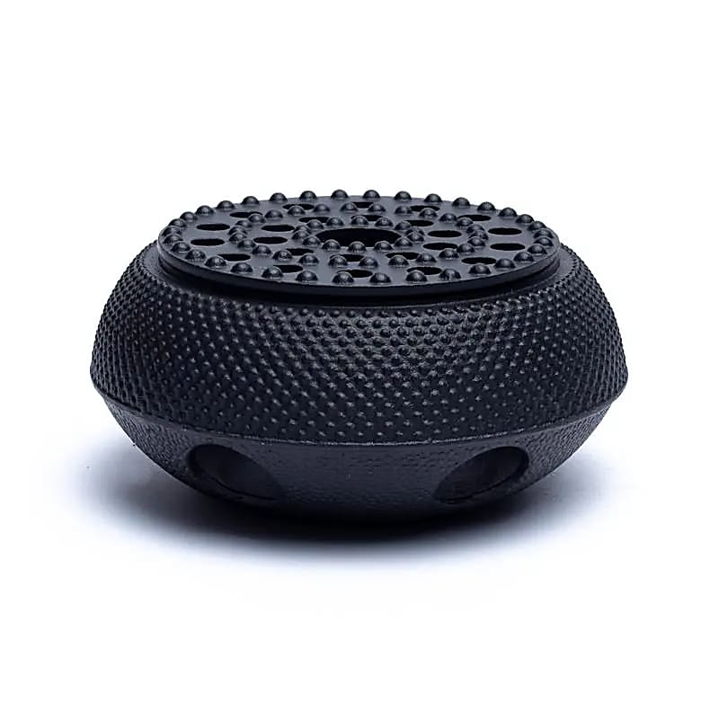 Chauffe théière en fonte